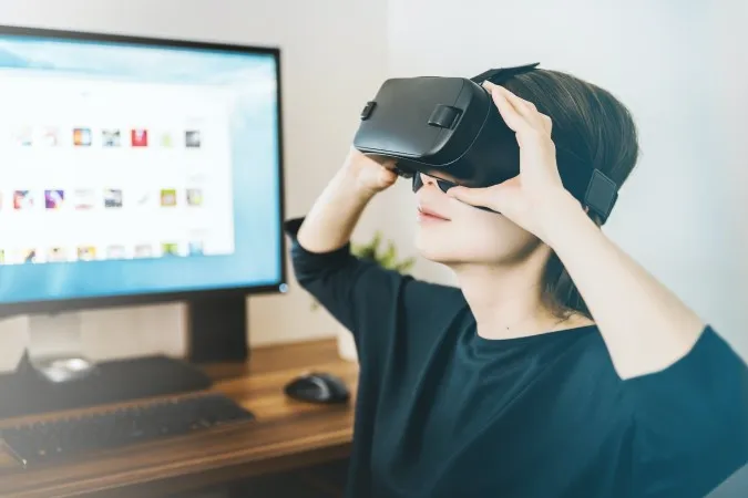 A photo of a person using a VR headset.